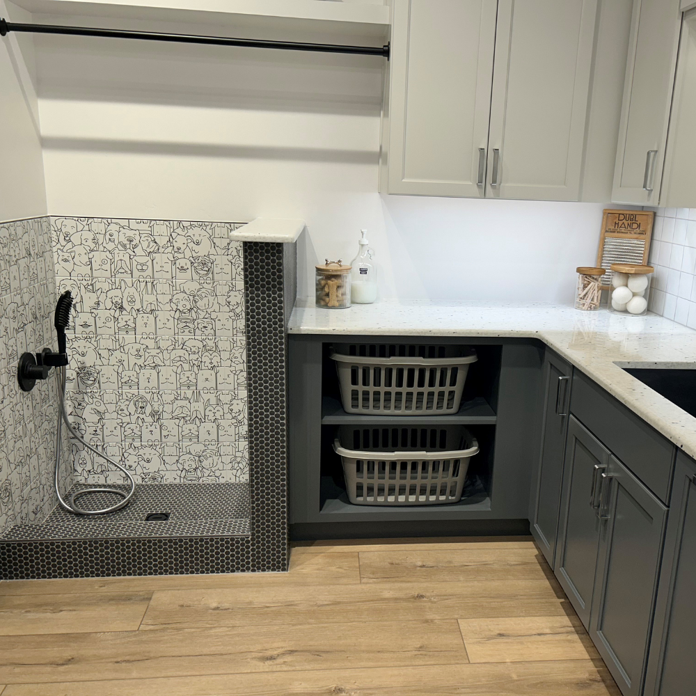 Custom laundry room with dog washing station at D&M Interiors Kiba Studios