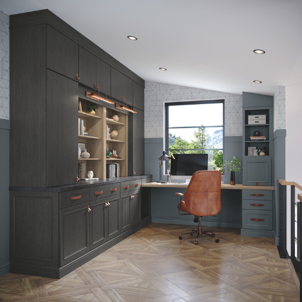 Home office cabinets with black hardware and a vanity area